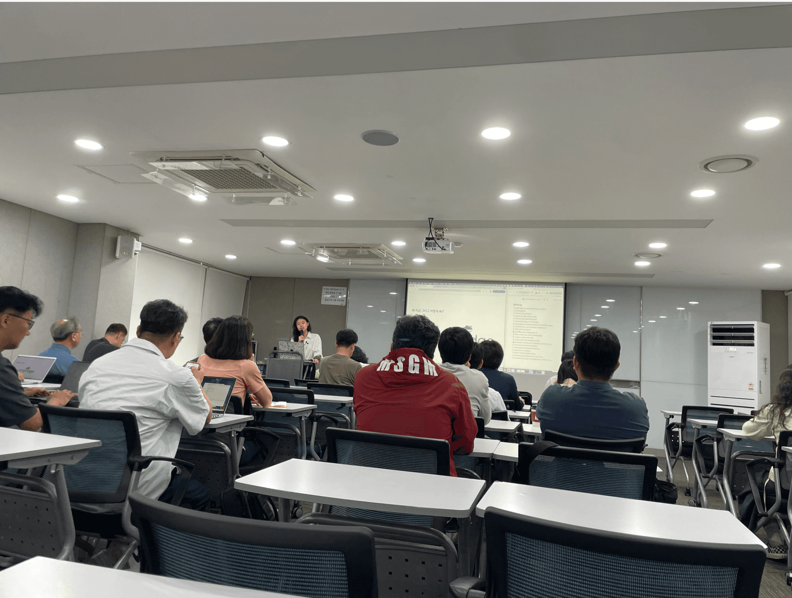 Minu teaching an enterprise AI seminar in Gangnam, June 2025.